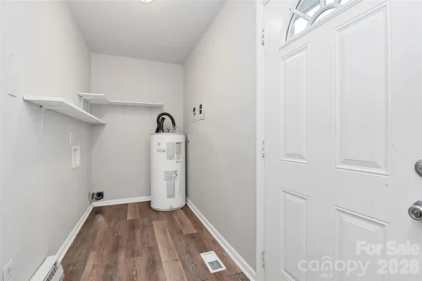a view of storage and utility room with closet