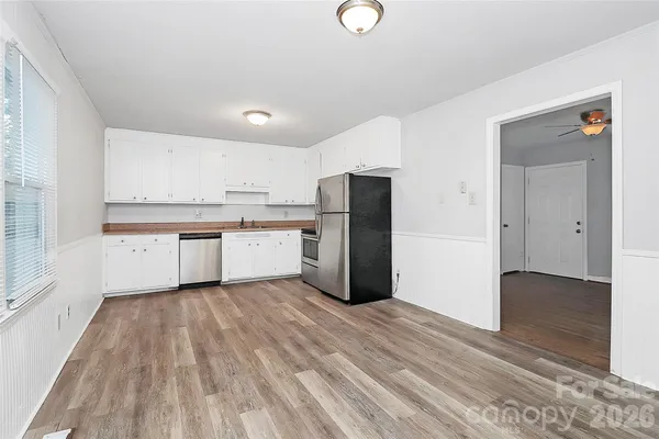 a kitchen with stainless steel appliances a refrigerator and a sink