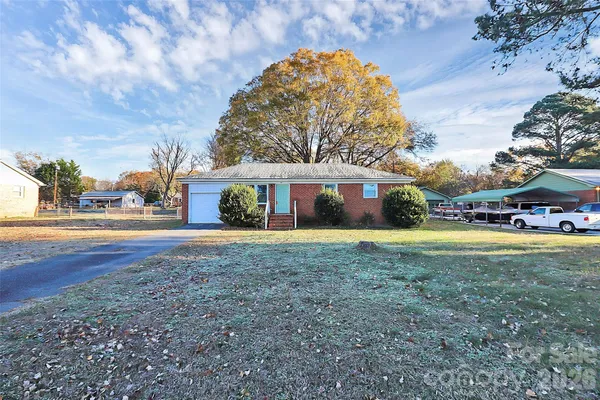 a front view of house with yard and green space