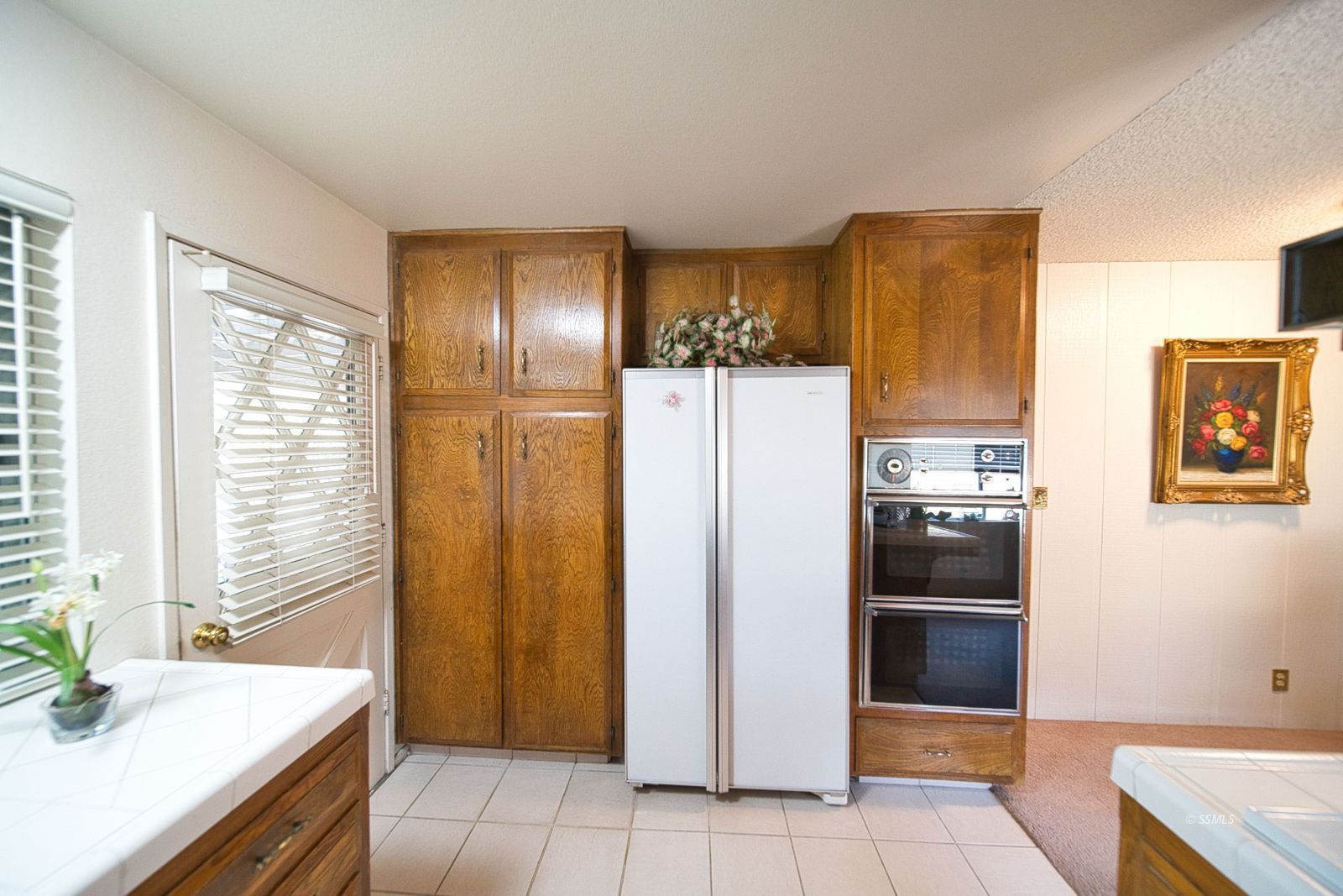 1024 Sherri Street Ridgecrest, CA 93555 - Photo 16 of 41 a kitchen with a refrigerator and a sink
