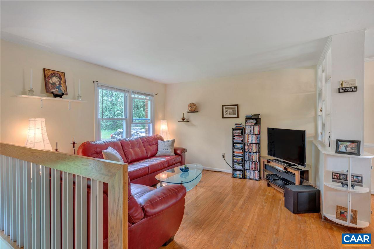 960 Claudius Court Crozet, VA 22932 - Photo 4 of 22 a living room with furniture and a flat screen tv