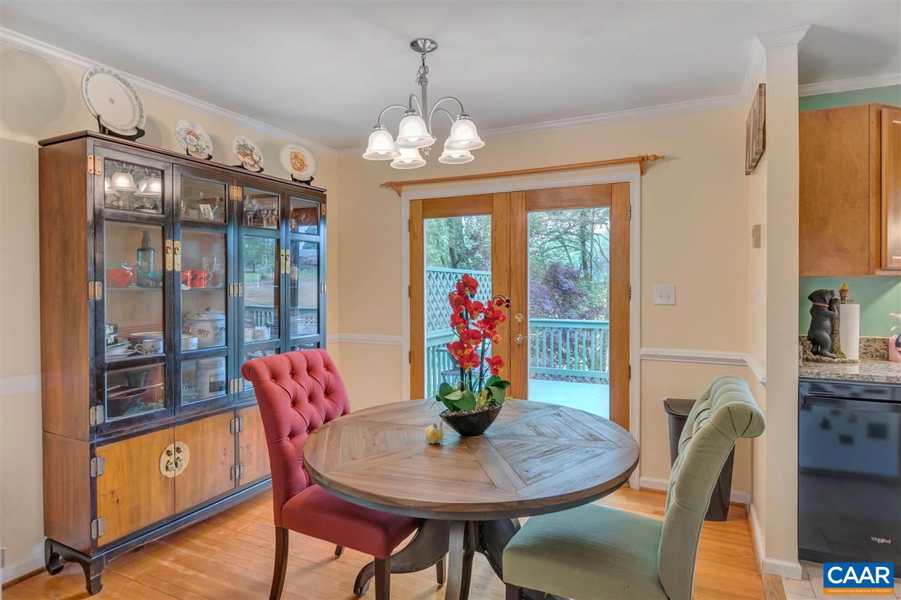 960 Claudius Court Crozet, VA 22932 - Photo 5 of 22 a view of a dining room with furniture window and outside view