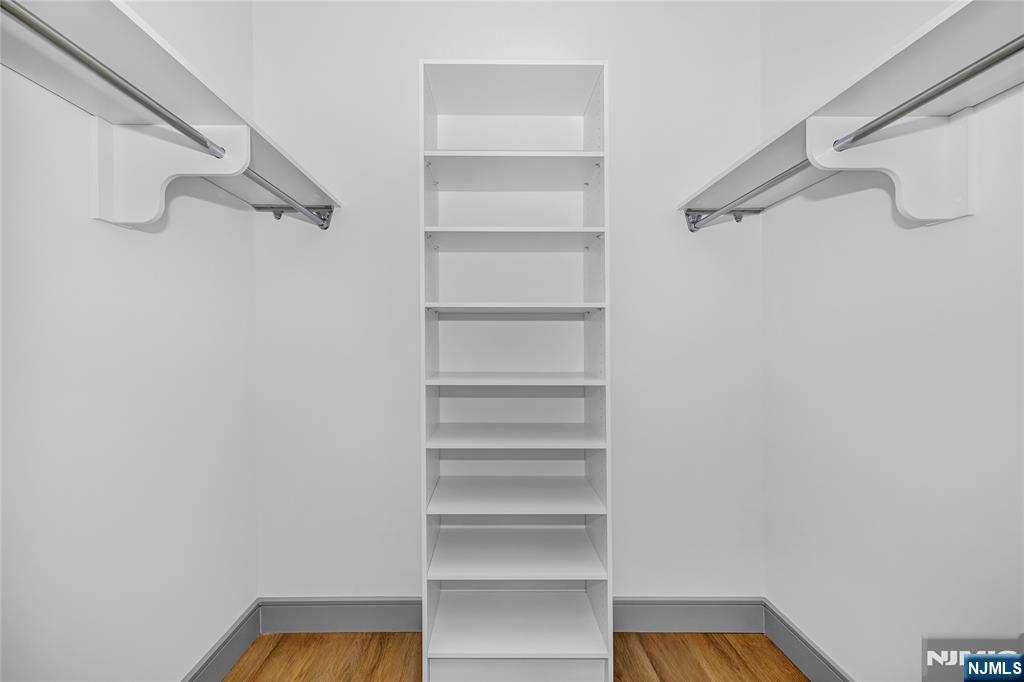 1435 10th Street, Unit 208 Fort Lee, NJ 07024 - Photo 12 of 23 a view of walk in closet with empty racks