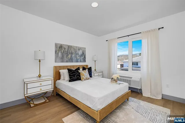 a bedroom with a bed and a table in it