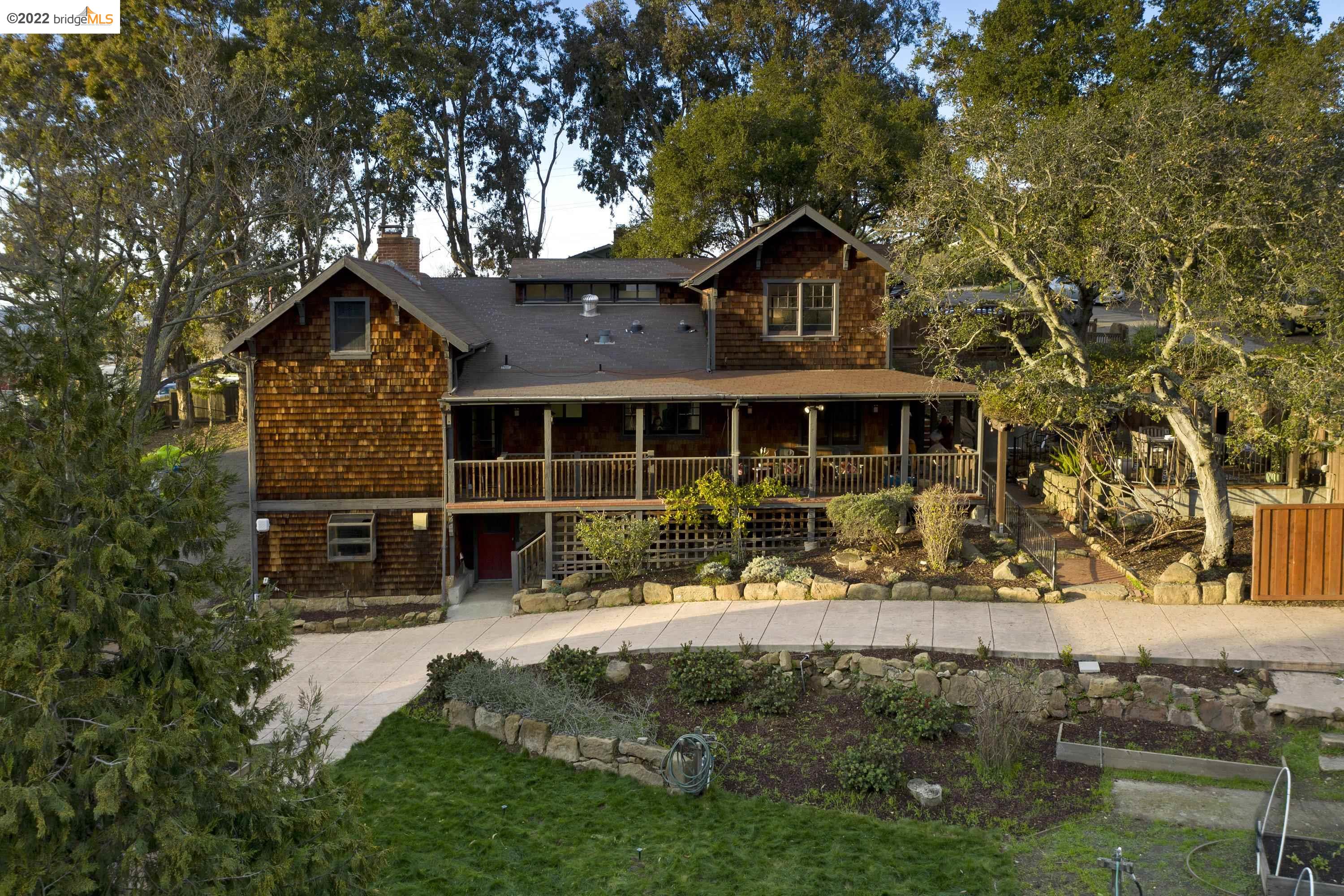 24987 Fairview Avenue Hayward, CA 94542 - Photo 1 of 1 a front view of a house with a garden and trees