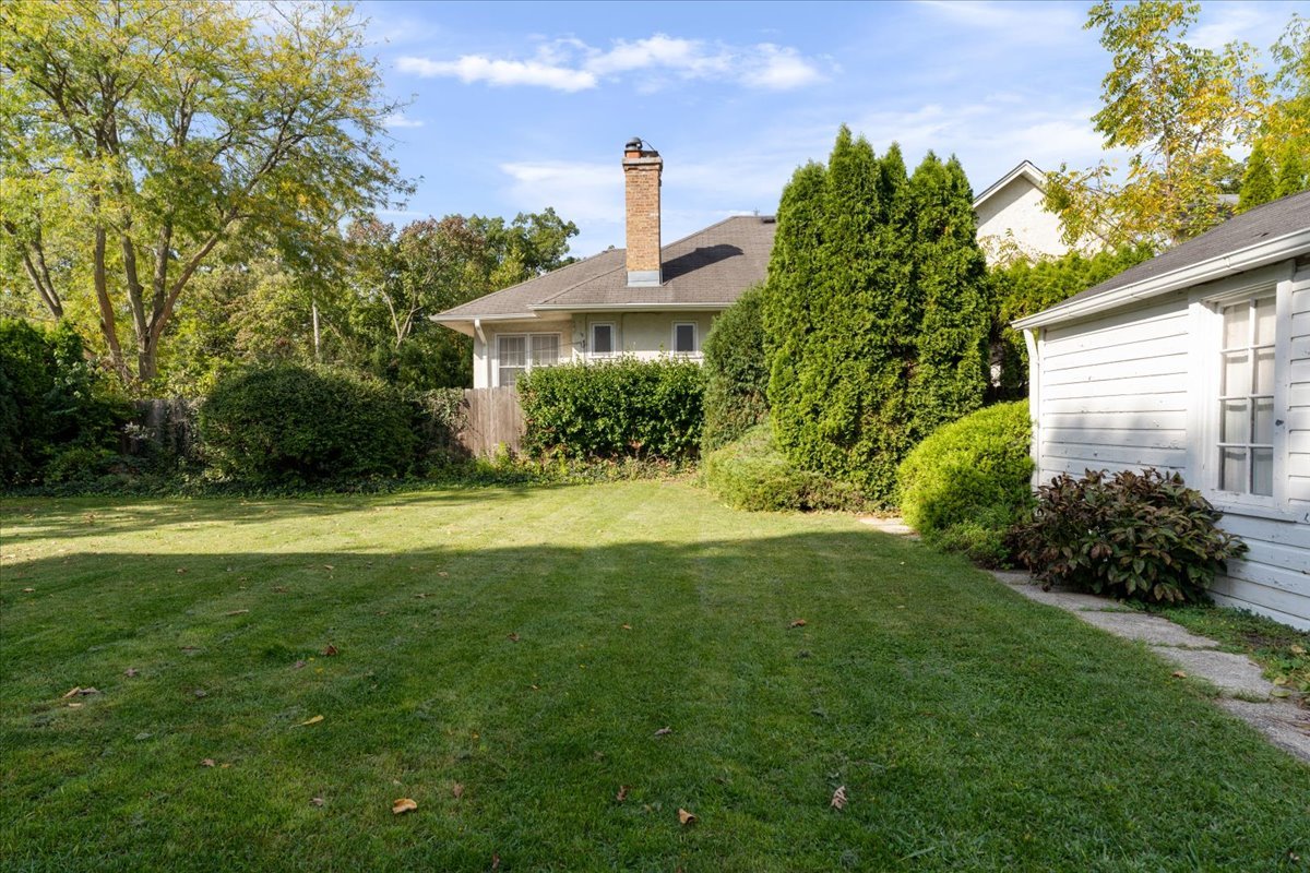 1097 Tower Road, Unit A Winnetka, IL 60093 - Photo 16 of 17 a front view of a house with a yard