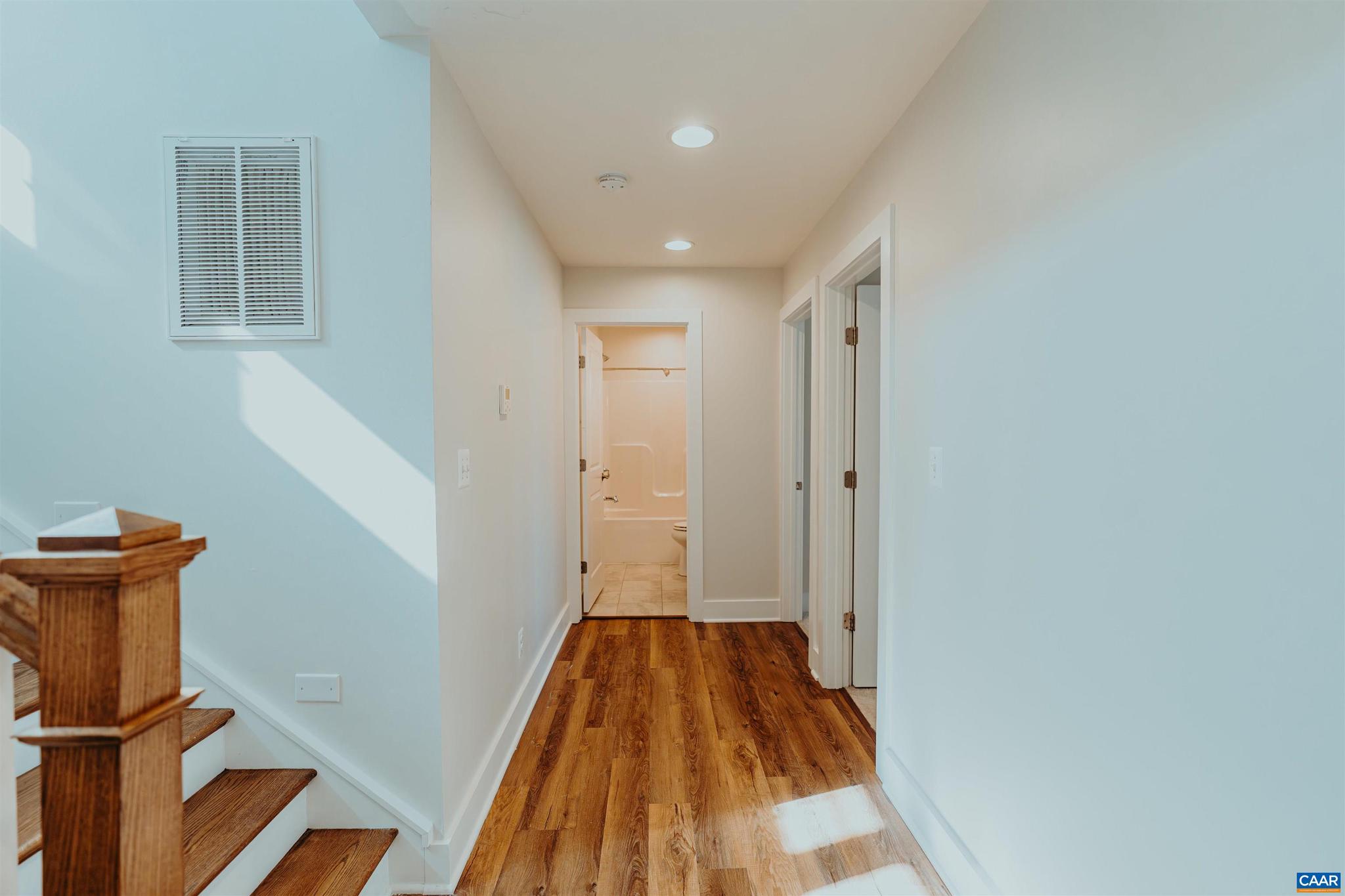 528 Trailside Drive Charlottesville, VA 22911 - Photo 37 of 51 a view of a hallway with wooden floor and staircase