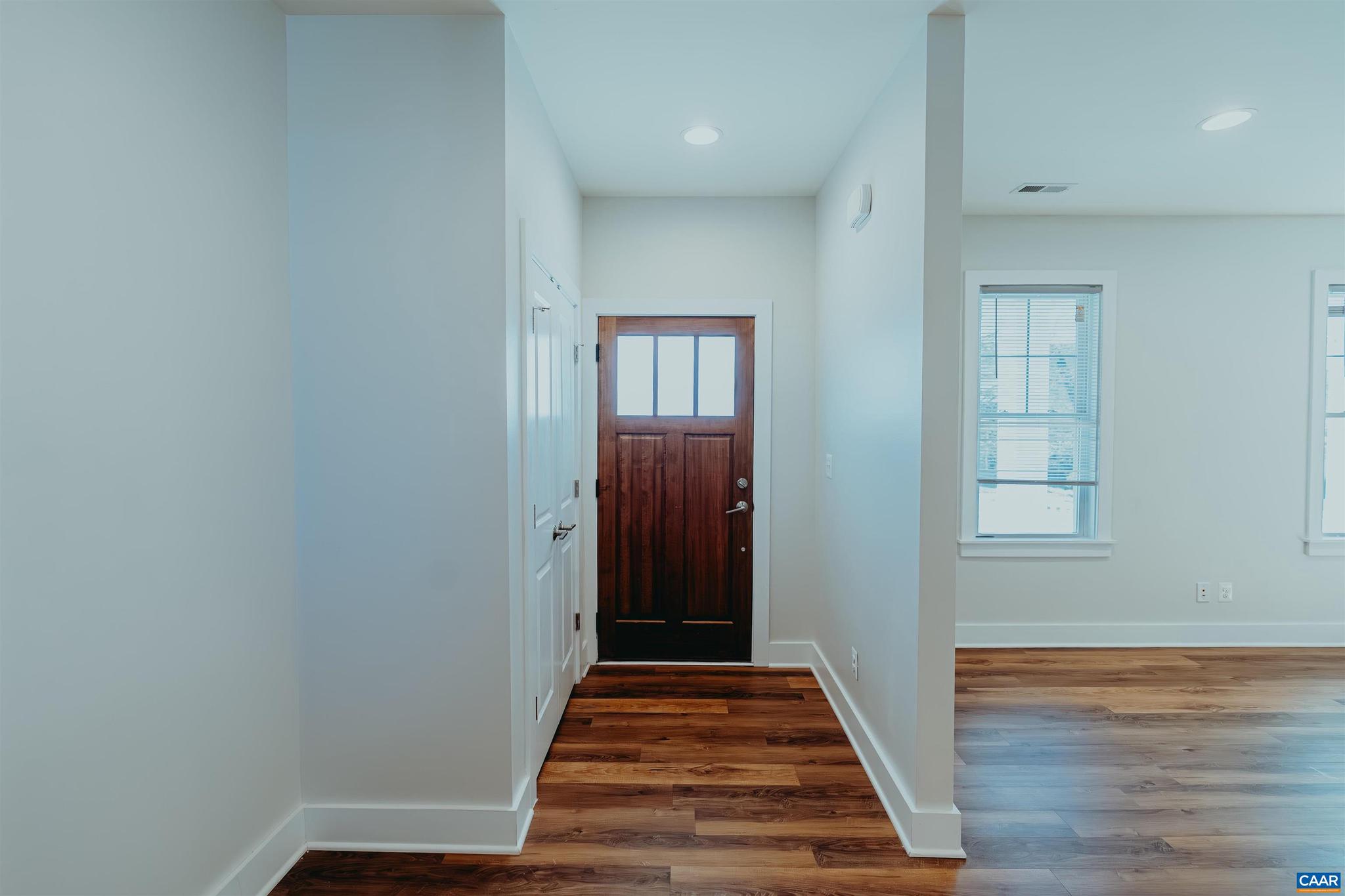 528 Trailside Drive Charlottesville, VA 22911 - Photo 5 of 51 a view of a hallway with wooden floor and closet