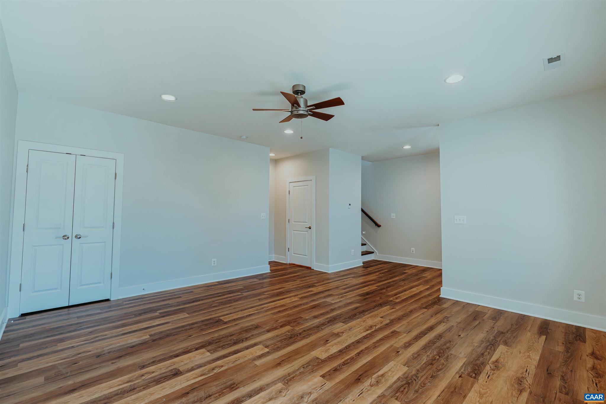 528 Trailside Drive Charlottesville, VA 22911 - Photo 9 of 51 a view of an empty room with a ceiling fan and window
