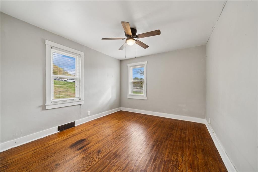 3425 Garvers Ferry Road New Kensington, PA 15068 - Photo 12 of 33 wooden floor in an empty room with a window
