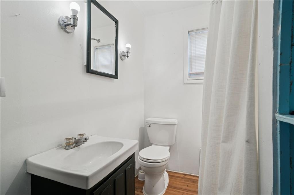 3425 Garvers Ferry Road New Kensington, PA 15068 - Photo 14 of 33 a white toilet sitting next to a bathroom sink