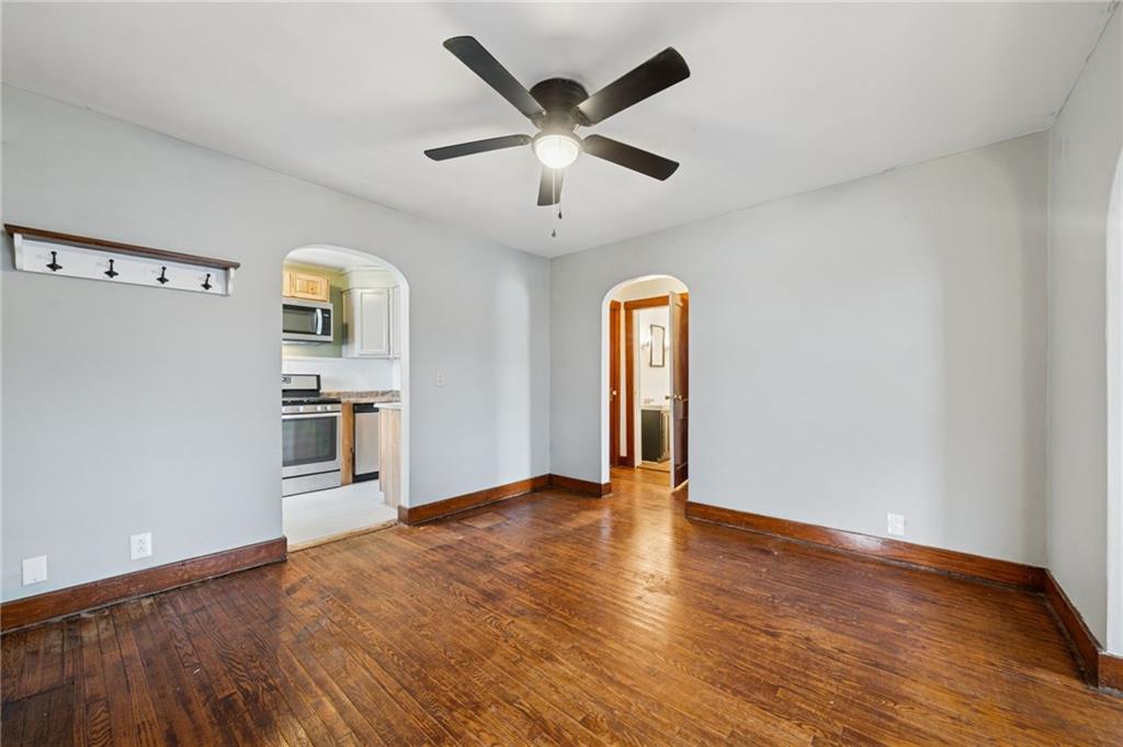 3425 Garvers Ferry Road New Kensington, PA 15068 - Photo 16 of 33 a view of an empty room with window and wooden floor