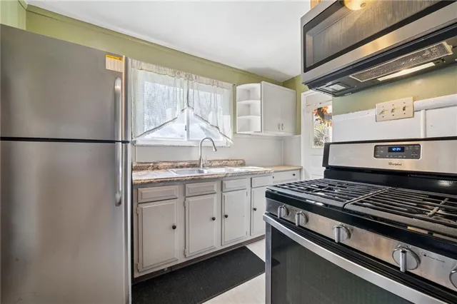 a kitchen with a stove and a refrigerator