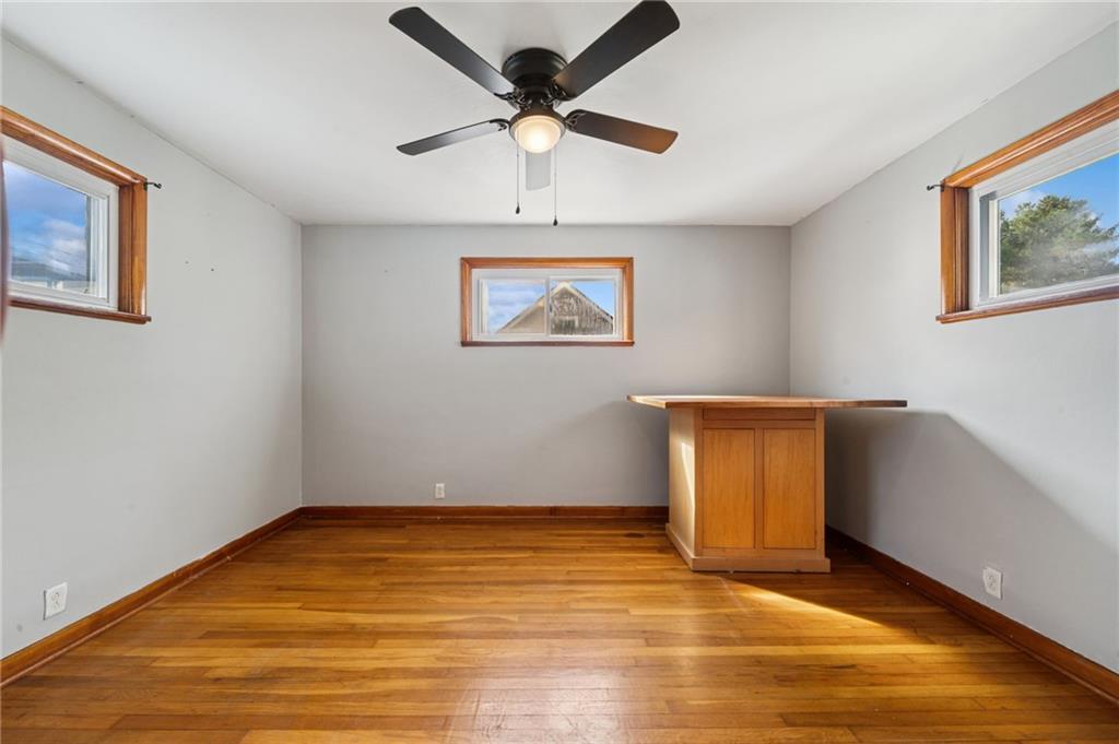 3425 Garvers Ferry Road New Kensington, PA 15068 - Photo 24 of 33 a view of an empty room with window and wooden floor