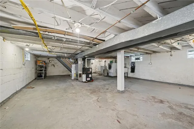 a view of empty room with wooden ceiling