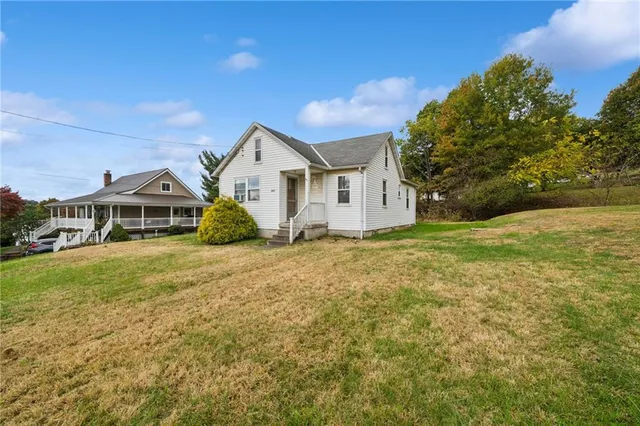 a front view of a house with yard