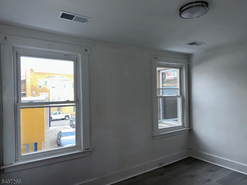 336 Broad Street, Unit 2 Bloomfield, NJ 07003 - Photo 7 of 24 an empty room with windows