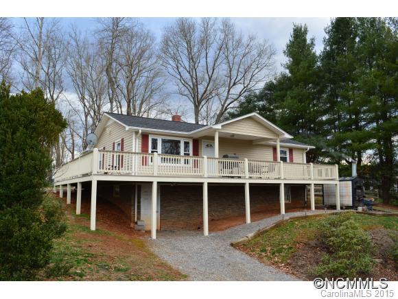 329 Ridgedale Road Clyde, NC 28721 - Photo 1 of 22 a front view of a house with a garden