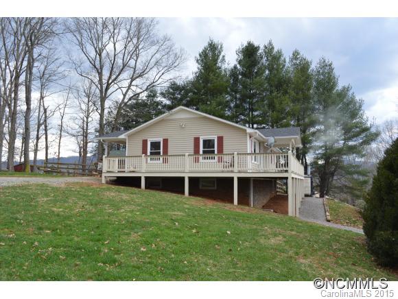 329 Ridgedale Road Clyde, NC 28721 - Photo 2 of 22 a view of house with a big yard and large trees