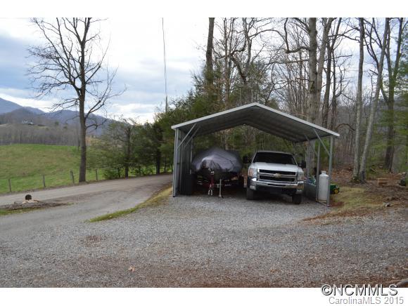 329 Ridgedale Road Clyde, NC 28721 - Photo 21 of 22 a view of a car parked in back yard of the house