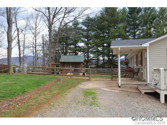 329 Ridgedale Road Clyde, NC 28721 - Photo 6 of 22 a view of a house with backyard porch and sitting area