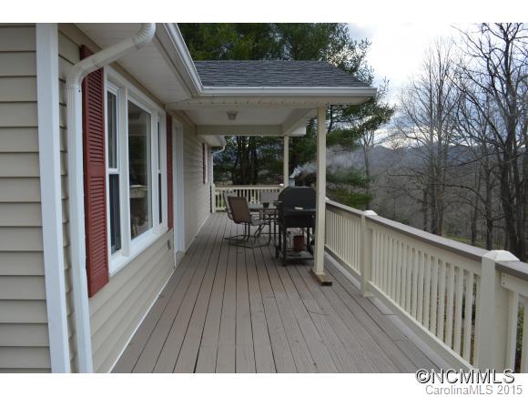 329 Ridgedale Road Clyde, NC 28721 - Photo 8 of 22 a balcony with table and chairs