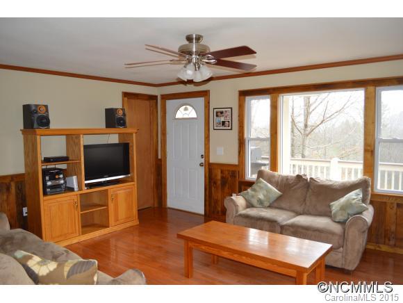 329 Ridgedale Road Clyde, NC 28721 - Photo 9 of 22 a living room with furniture and a flat screen tv