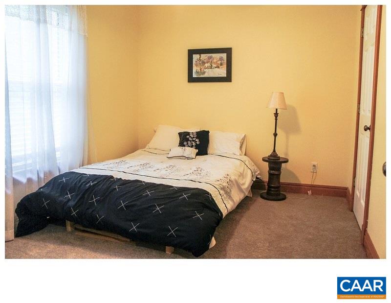 68 Amethyst Road Palmyra, VA 22963 - Photo 14 of 30 a bedroom with a bed next to a window