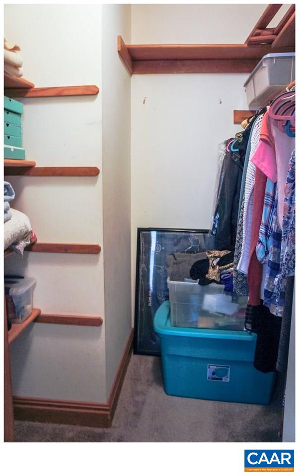 68 Amethyst Road Palmyra, VA 22963 - Photo 17 of 30 a room with water heater and wooden cabinets