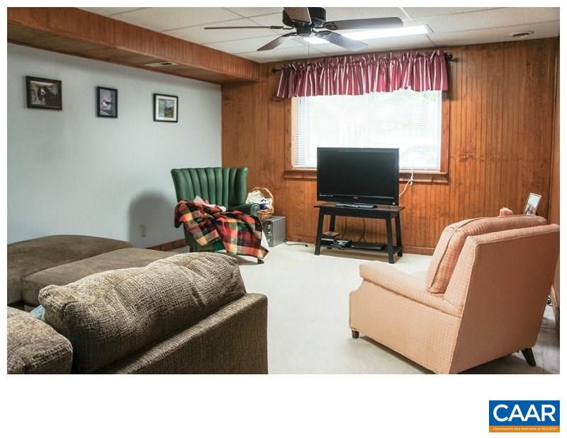 68 Amethyst Road Palmyra, VA 22963 - Photo 19 of 30 a living room with furniture and a flat screen tv