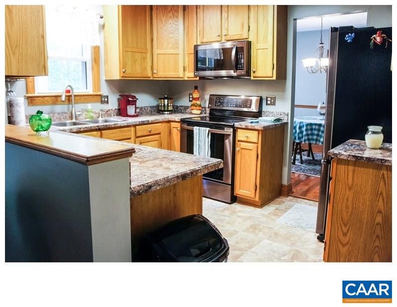 68 Amethyst Road Palmyra, VA 22963 - Photo 6 of 30 a kitchen with stainless steel appliances kitchen island granite countertop a sink counter space and stainless steel appliances