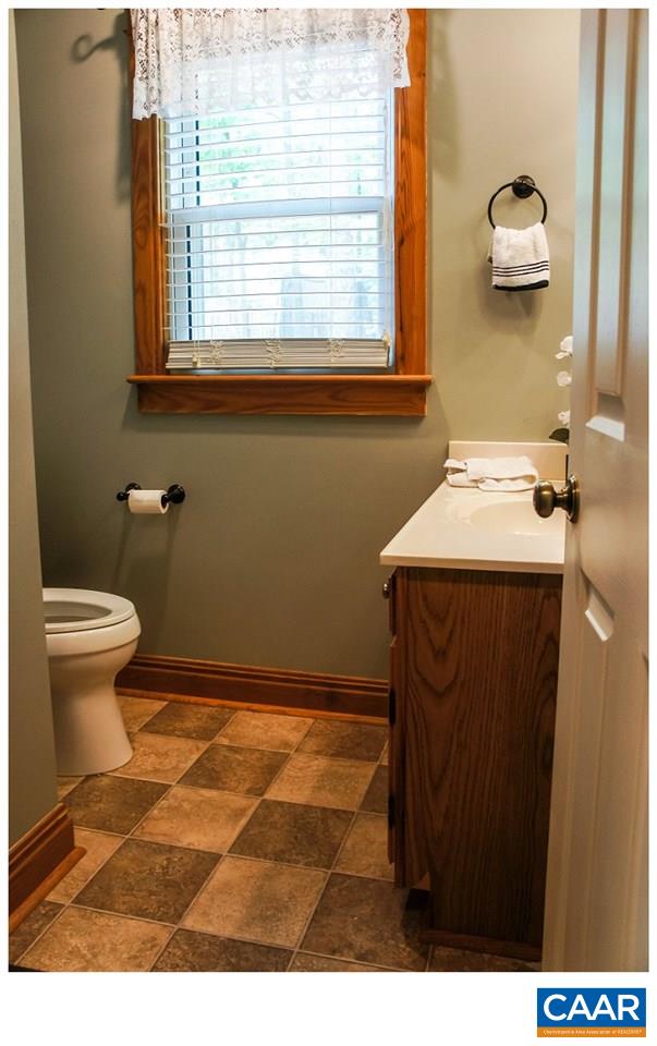 68 Amethyst Road Palmyra, VA 22963 - Photo 8 of 30 a bathroom with a sink a toilet and a window