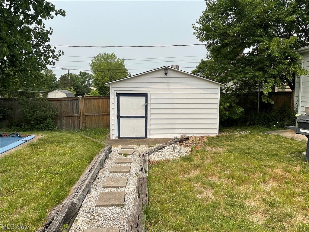 13052 Atlantic Road Strongsville, OH 44149 - Photo 19 of 33 Out building for pool heater & supplies