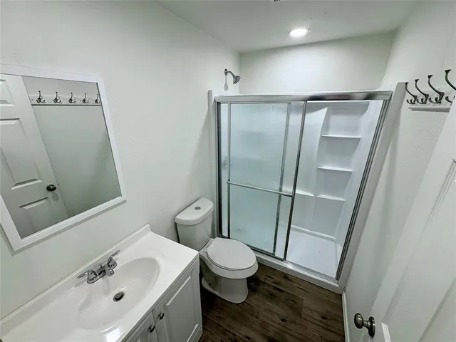 a bathroom with a sink toilet and shower