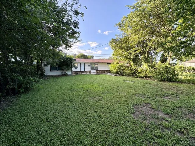a view of a house with a big yard
