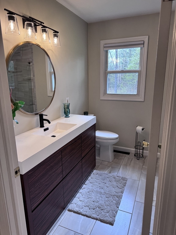 1260 Westhampton Road Northampton, MA 01062 - Photo 23 of 42 a bathroom with a sink and a mirror