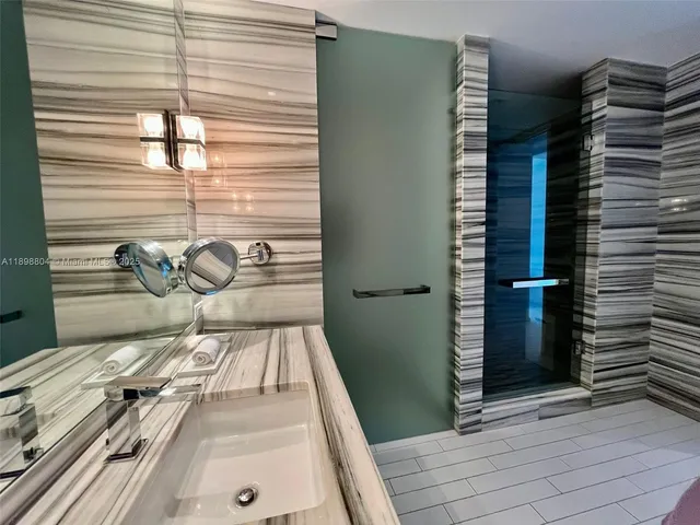 a view of a balcony with a door and a window