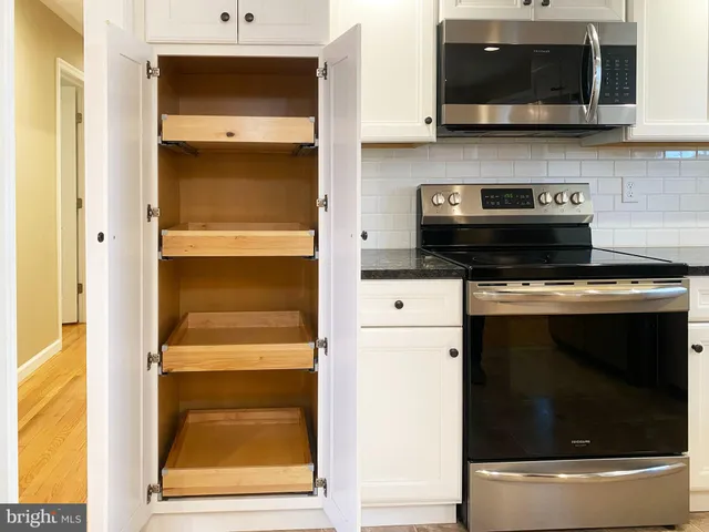 a kitchen with a stove and a microwave
