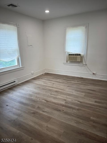 252 Spring Street Newton, NJ 07860 - Photo 5 of 18 a view of a room with wooden floor and a window