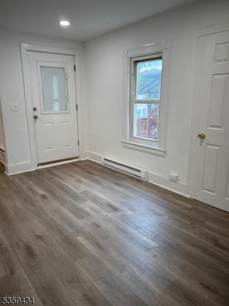 252 Spring Street Newton, NJ 07860 - Photo 9 of 18 an empty room with wooden floor and windows