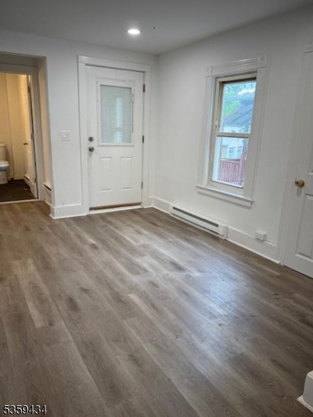 252 Spring Street Newton, NJ 07860 - Photo 10 of 18 an empty room with wooden floor and windows