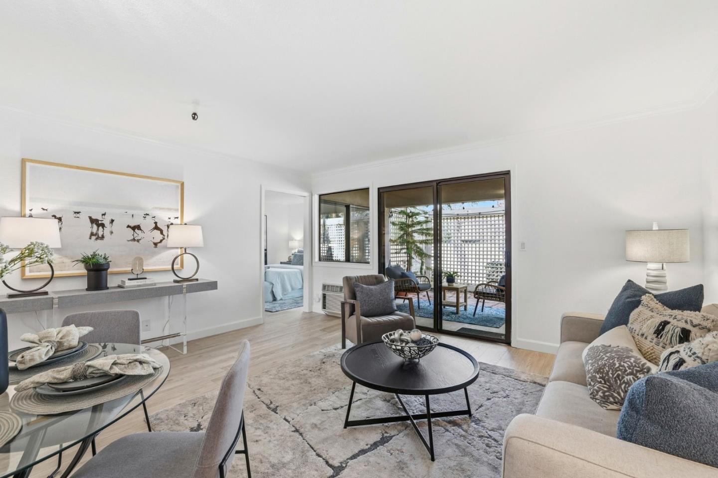 449 Alberto Way, Unit 132 Los Gatos, CA 95032 - Photo 1 of 42 a living room with furniture and a wooden floor