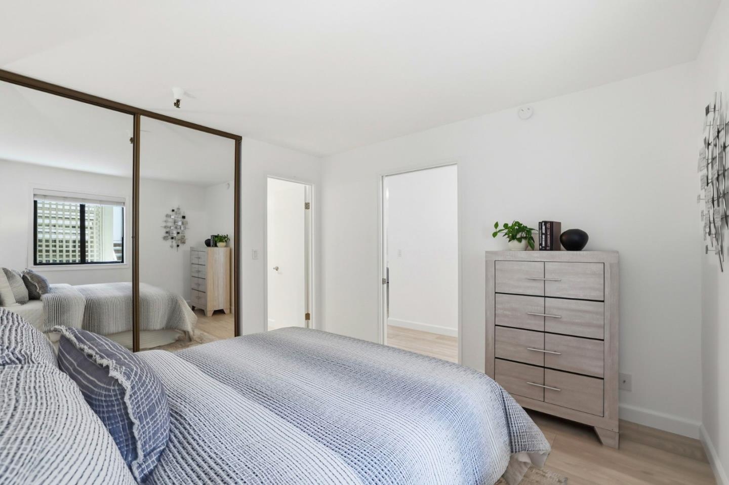 449 Alberto Way, Unit 132 Los Gatos, CA 95032 - Photo 13 of 42 a bedroom with a bed and a dresser