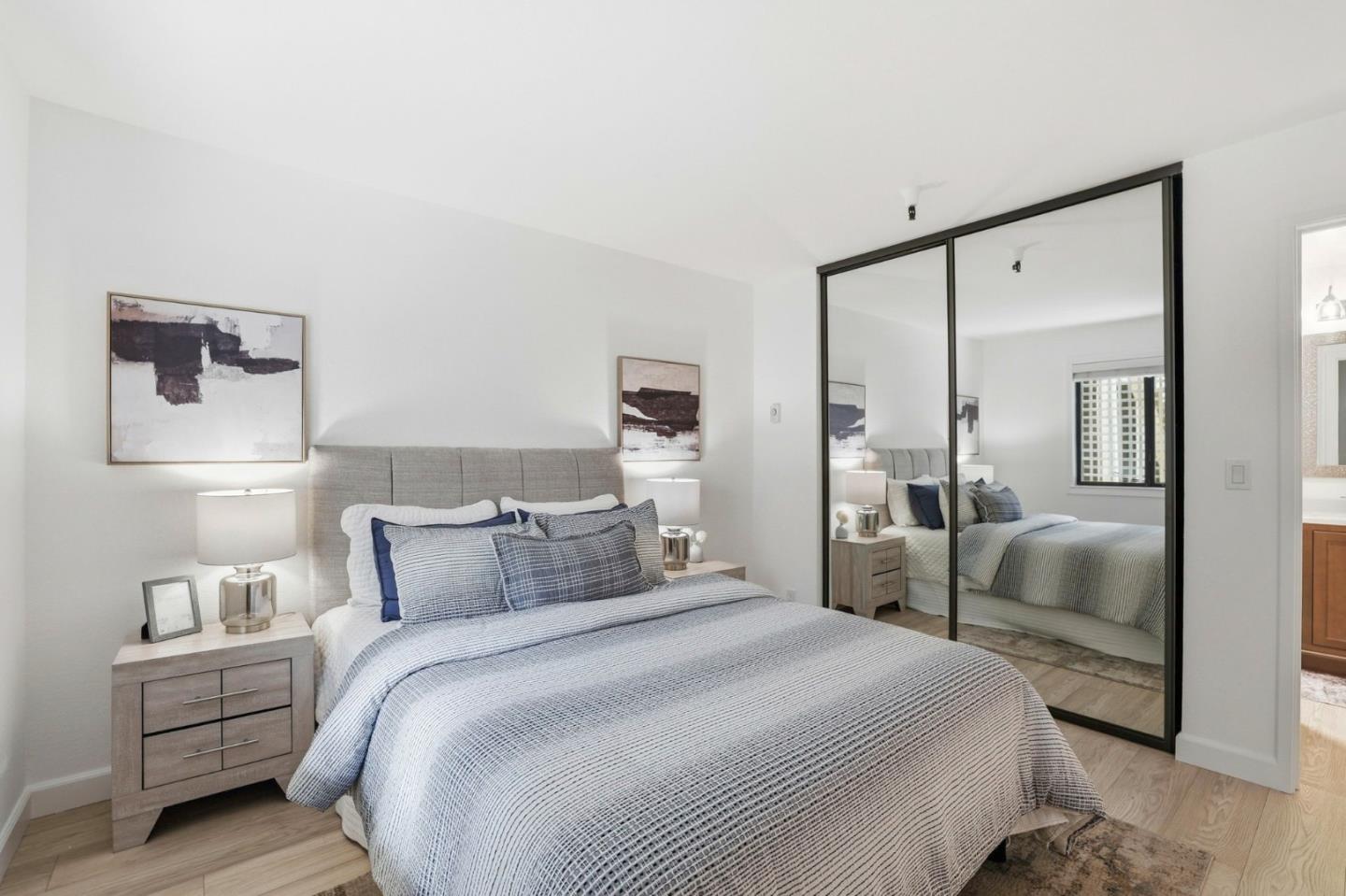 449 Alberto Way, Unit 132 Los Gatos, CA 95032 - Photo 14 of 42 a bedroom with a bed and a mirror