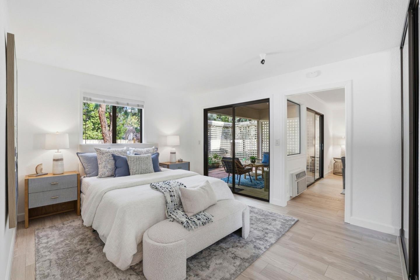 449 Alberto Way, Unit 132 Los Gatos, CA 95032 - Photo 15 of 42 a bedroom with a large bed and a large window
