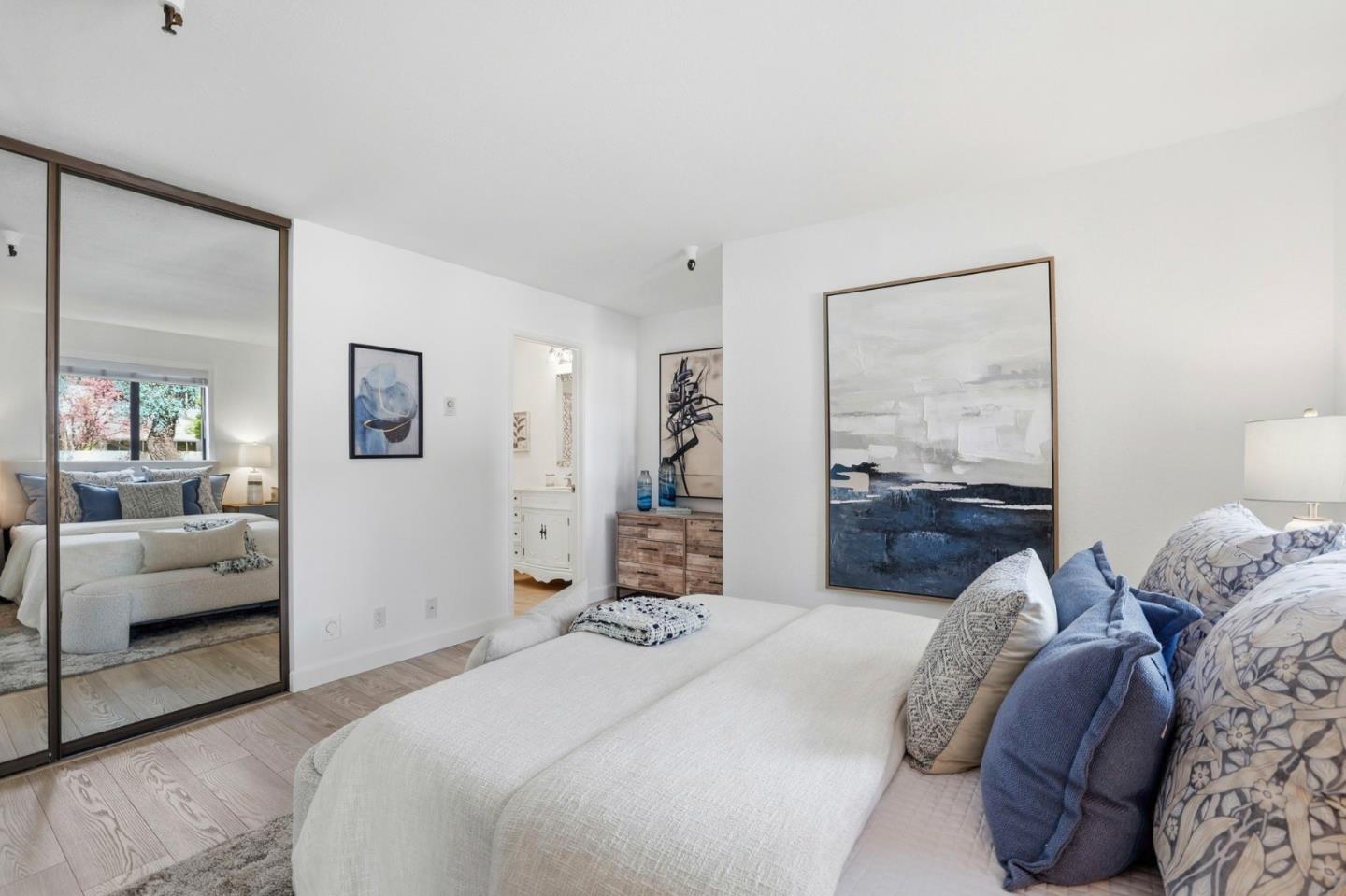 449 Alberto Way, Unit 132 Los Gatos, CA 95032 - Photo 18 of 42 a bedroom with a large bed and a couch