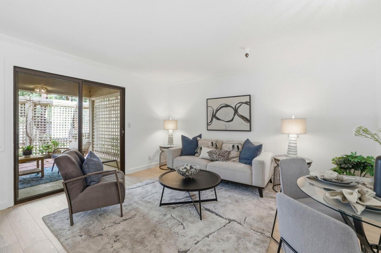 449 Alberto Way, Unit 132 Los Gatos, CA 95032 - Photo 2 of 42 a living room with furniture and a large window