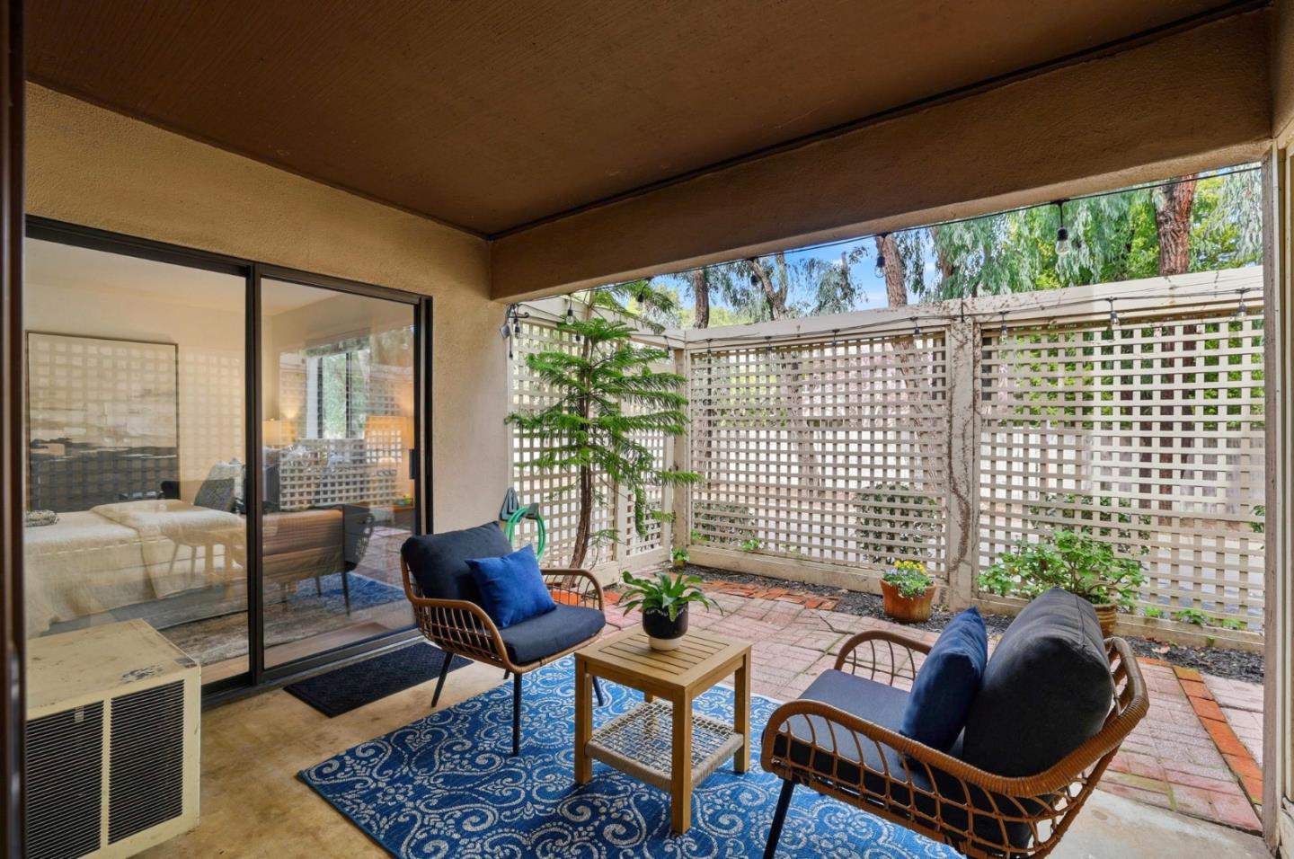 449 Alberto Way, Unit 132 Los Gatos, CA 95032 - Photo 23 of 42 a living room with furniture and a floor to ceiling window