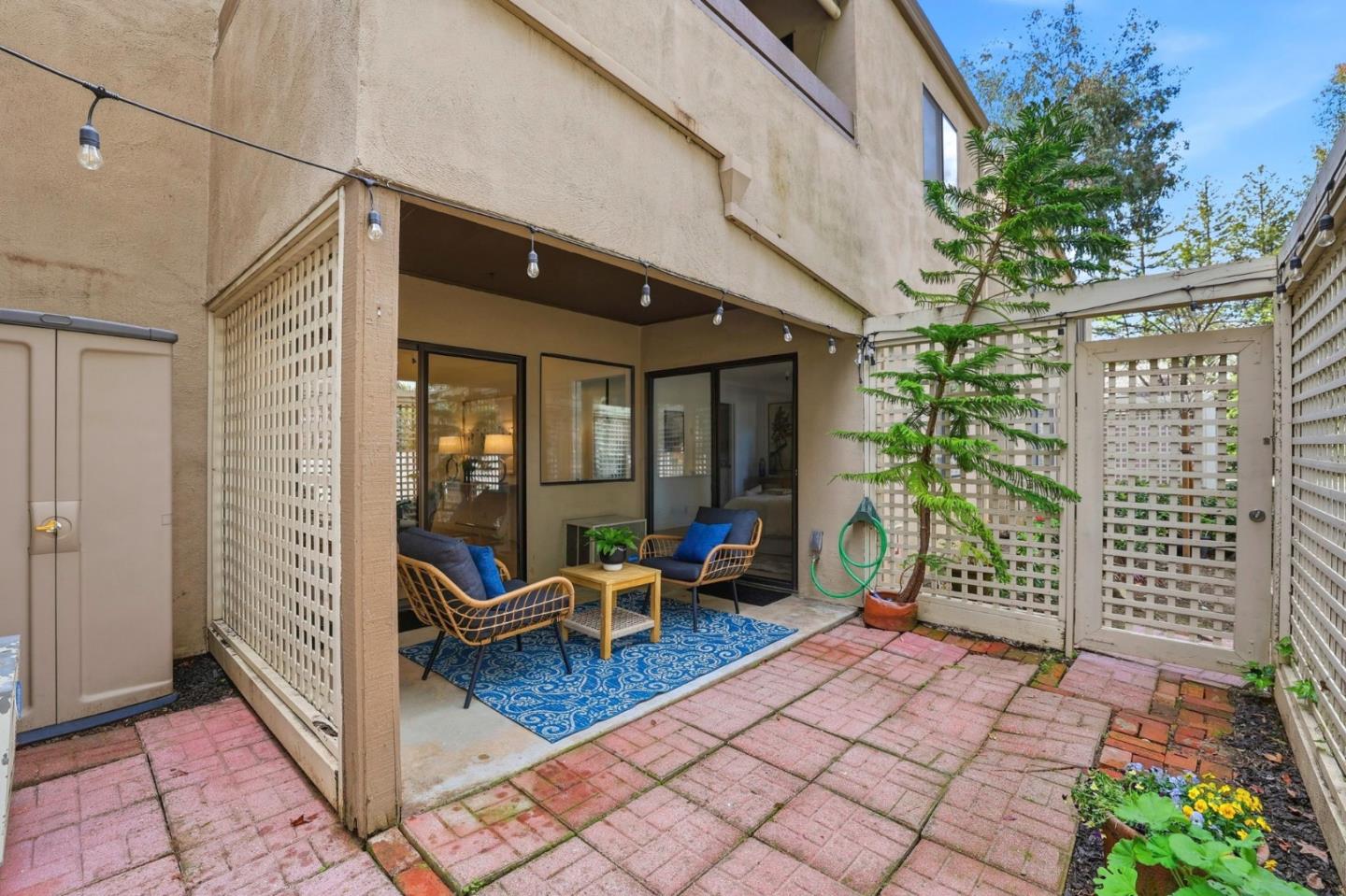 449 Alberto Way, Unit 132 Los Gatos, CA 95032 - Photo 25 of 42 a view of a patio with table and chairs and potted plants