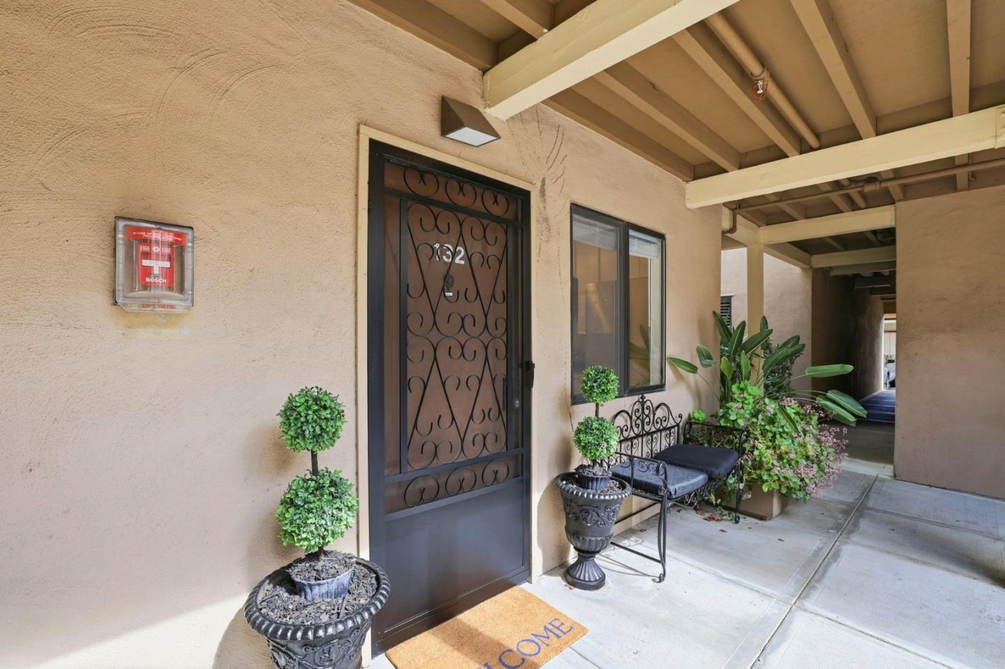 449 Alberto Way, Unit 132 Los Gatos, CA 95032 - Photo 28 of 42 a potted plant sitting in front of a house